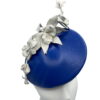 Blue leather teardrop with white leather flower detail.